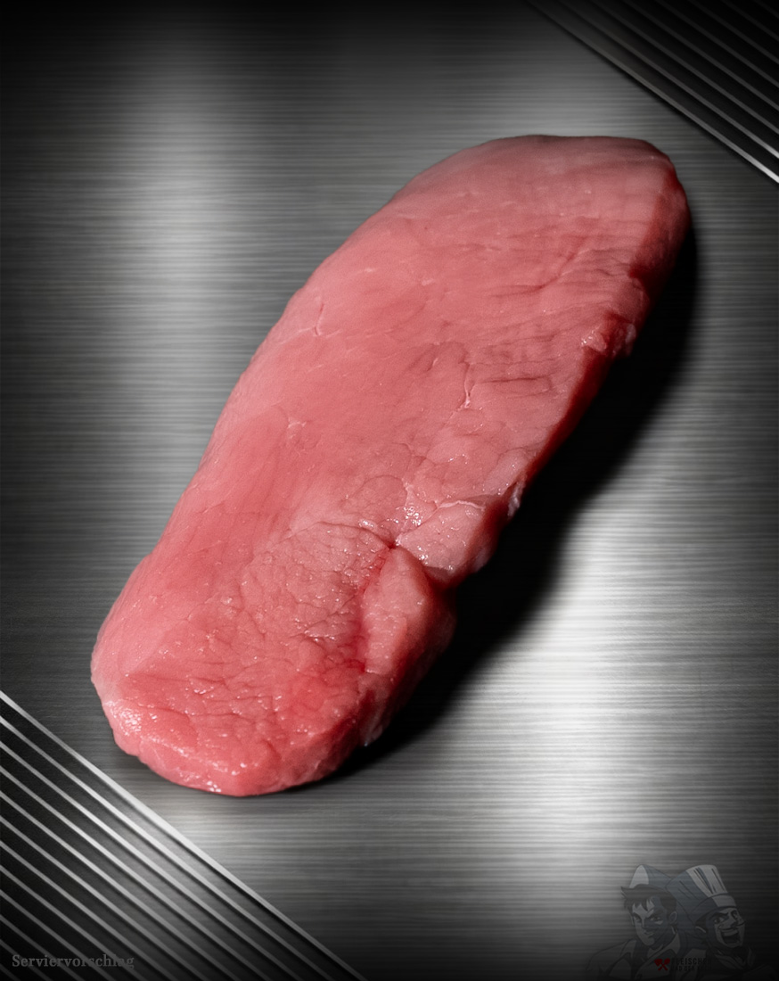 Schnitzel-vom-regionalen-Duroc-Schwein-aus-Deutschland Rohes Schnitzel vom regionalen Duroc-Schwein mit feiner Marmorierung auf neutralem Untergrund.