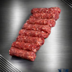 Michalski Cevapcici vom Landschwein roh auf dunklem Untergrund